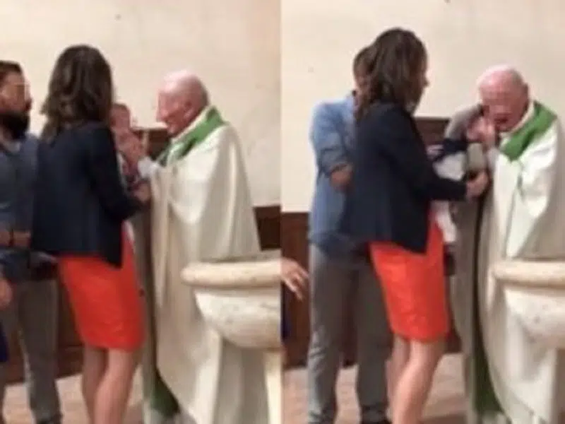 Immagini choc, durante battesimo prete prende e schiaffi il bambino e lo strattona, l’intervento dei genitori – video